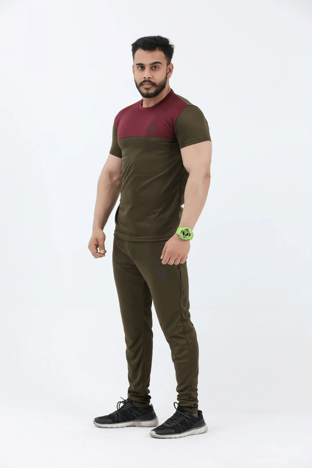 Man wearing a two-tone athletic outfit on a white background